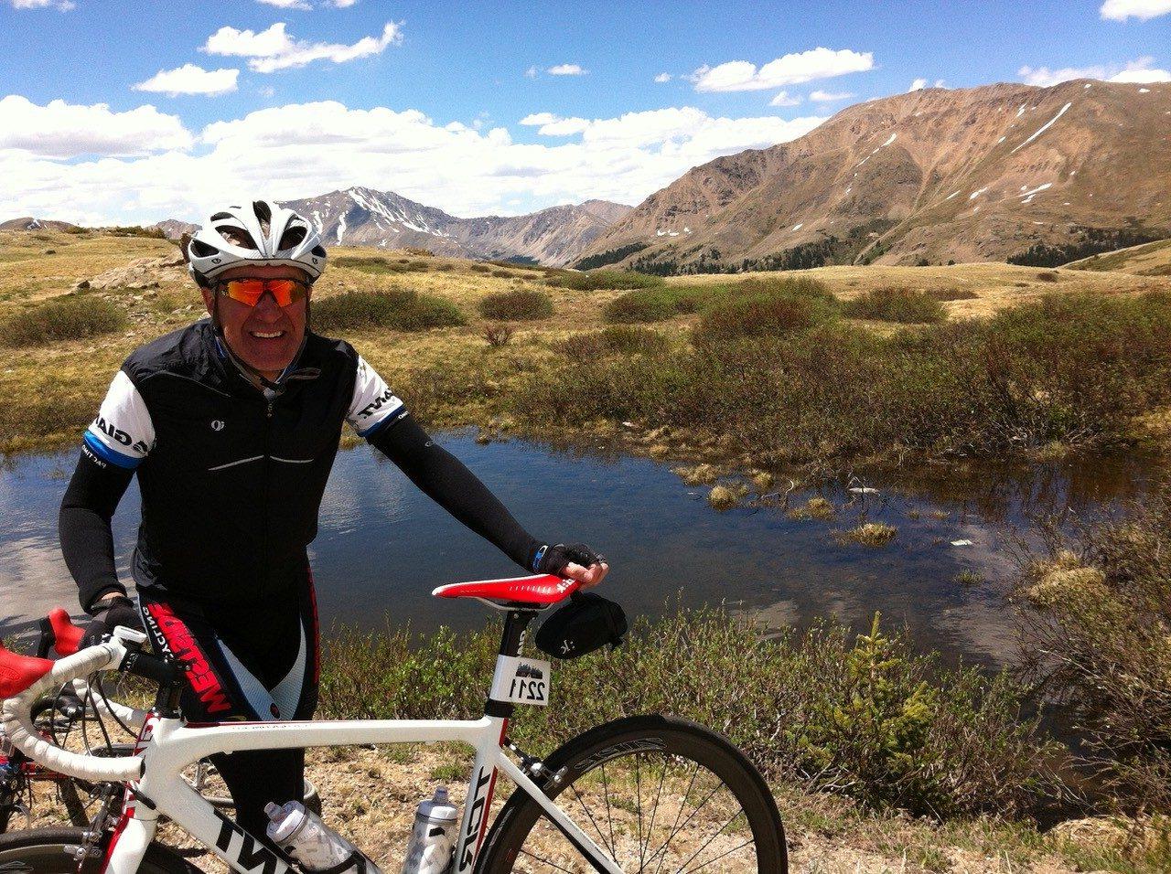 Richard on a bike in the mountains